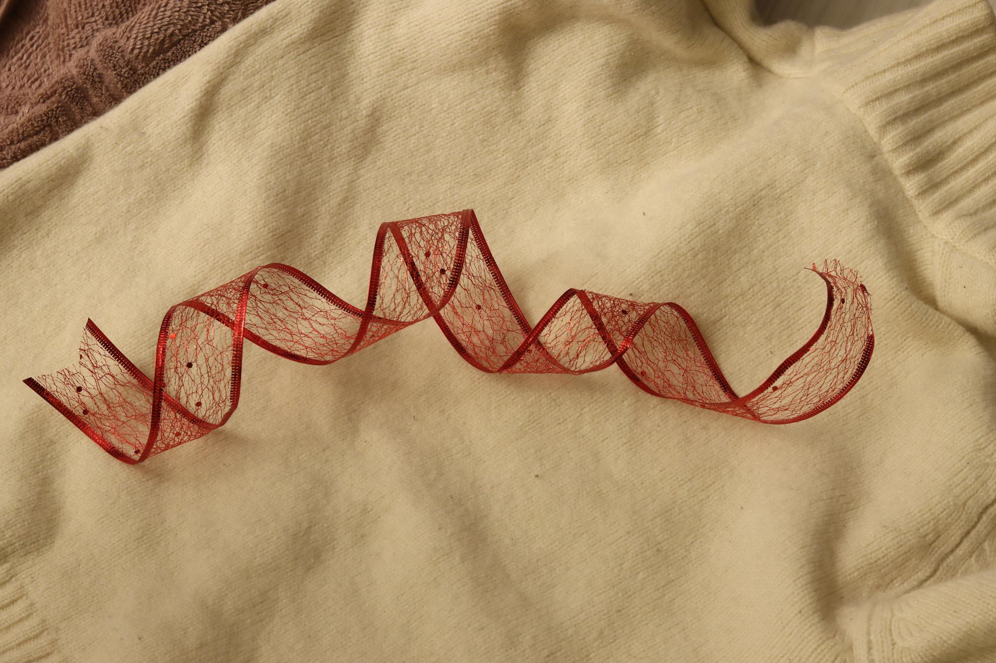 Close-up of hand embroidery with textured threads